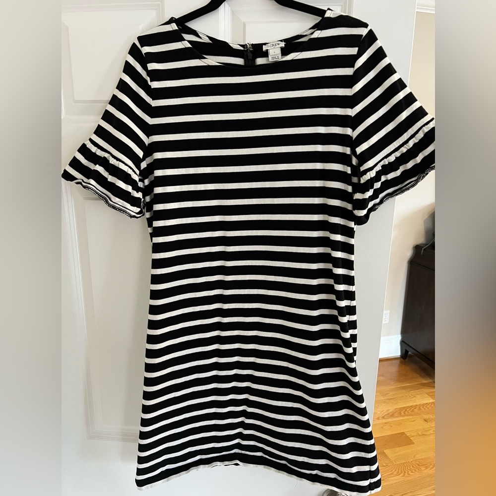 J Crew black & white sheath dress with short sleeves with ruffle detail.